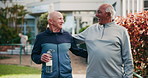 Fitness, walk and senior friends at park for funny joke, hug and laughing at retirement house. Water bottle, elderly men and conversation for healthy body, exercise or physical therapy for wellness