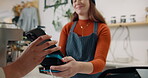 Hand, cashier and pos payment in cafe for coffee purchase, transaction or scanning mobile. Service, barista woman and customer at restaurant for bill, nfc machine or point of sale with smartphone