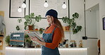 Business owner, woman and scroll on tablet in cafe for order management, inventory control and schedule delivery. Female waitress, digital and web for e commerce stock, menu planning or food service 