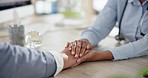 Holding hands, doctor and old woman with wellness, closeup or cancer diagnosis. Professional, medical or patient with retirement, healthcare and advice with support, compassion or treatment in clinic