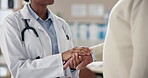 Female doctor, holding hands and senior man for advice in clinic for appointment, wellness and elderly care. Male patient, help and empathy with medical staff, support or routine check up in hospital