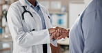 Doctor, holding hands and senior woman with advice in clinic for appointment, wellness and elderly care. Female people, help and patient as medic, staff and support in hospital for routine check up