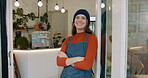 Woman, small business and smile at cafe with arms crossed for growth and ownership. Coffee shop, waiter and happy or proud on portrait in restaurant entrance for investment as entrepreneur and proud