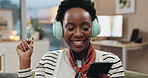 Black woman, headphones and dance on sofa with phone, listening and music with streaming in home living room. Person, happy and smartphone for subscription, audio and moving with mobile app in house