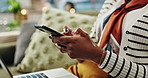 Black woman, hands and typing with phone for research, online browsing or email on sofa at home. Closeup of young African or female person on mobile smartphone with laptop for communication at house