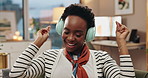 Black woman, headphones and dancing on sofa with smile, listening and music with streaming in home living room. Person, happy and excited for subscription, audio and moving with singing in house