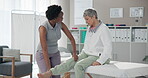 Physiotherapist, rehabilitation and knee of mature woman in clinic for wellness, arthritis and balance. Geriatric therapist, massage and stretching legs with osteoporosis, sciatica or gout for health