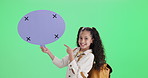 Girl, pointing and speech bubble on green screen space for back to school information, chat or language translation. Face of child or student with backpack, wow and mockup quote by studio background