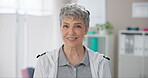 Mature woman, happy and physiotherapist in office with confidence for physical therapy or recovery service. Chiropractor portrait, person and smile at workplace for rehabilitation and wellness clinic