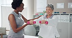 Weights, physiotherapy and woman with mature patient for wellness, medical service and consulting. Healthcare, chiropractor and physical therapist with person for rehabilitation, recovery or mobility