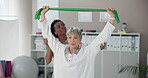 Women, physiotherapist and senior patient with resistance band for support, progress and healthcare. People, injury and happy in clinic for fitness, exercise and workout for trust and rehabilitation