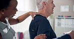 Senior, man and physiotherapist with exercise for shoulder pain in clinic with healthcare and injury treatment. Physical therapy, medical expert and elderly patient with recovery and rehabilitation