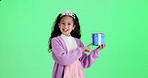 Girl, point and gift box by green screen with face, smile and crown on birthday by studio background. Child, princess and tiara in portrait with present, package or choice by mockup space in Colombia