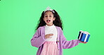 Child, face and dancing with gift by green screen for secret present, surprise and package of prize. Box, ribbon and tiara on girl with celebration in studio for giveaway, product or parcel of winner