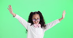 Girl, child and dance or celebration on green screen for success, confidence and excited energy in school. Excited student or kid practice for contest, creativity and self esteem on studio background