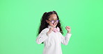 Girl, kid and dance or celebration on green screen for success, confidence and excited in cool or trendy fashion. Excited child with energy, self esteem and practice movement on studio background