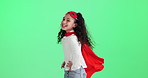 Girl, superhero and child in cape by green screen with smile, excited or face in funny game by background. Kid, happy and playful with mask, comic and fight crime in fantasy for power by mockup space