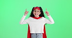 Girl, child and hero with point by green screen with face, smile or fantasy by studio background. Kid, excited and portrait with superpower, choice or decision for review by mockup space in Colombia