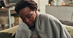 African woman, sick and nose blow with tissue, blanket and wipe in house for virus, allergy and flu. Female person, cold and sneeze with paper for sinusitis, fever and cough for winter or health 