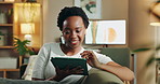 Home, relax and black woman on couch, tablet and internet with connection, playing online game and website info. African person, apartment and happy girl on sofa, tech and social media in living room