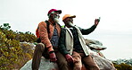 Hiking, selfie and black men with friend for summer vacation, climbing and mountain trekking. Smile, adventure and Mature guys in nature for exercise, travel and retirement hobby for memory together