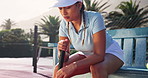 Sports, tennis and woman on bench thinking for competition, tournament match and game. International athlete, fitness and person with racket on court for training, exercise and practice for event