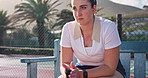 Tennis racket, bench and woman with thinking at court for break, recovery and outdoor sports match. Athlete, serious and person with equipment of game for competition, training and practice in Paris