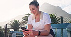 Tennis player, woman and happy with phone on court for text message, communication or social media at break. Sports, athlete and relax on bench with online fitness app, game research and mobile chat