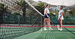 Conversation, sports and tennis players on court with racket and ball for practice together with team. Discussion, fitness and women athletes by net for strategy plan for match, competition or game.