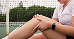 Tennis player, hands and knee with pain on court with injury, accident and sprain during game, match or practice. Sport, woman and broken leg with medical problem, fracture or sore muscle at training