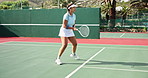 Woman, tennis and court with fitness, sports and training with sunshine, exercise and contest. Person, outdoor and player with racket, practice and competition with hobby, activity and recreation