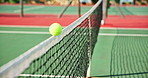 Tennis, court and ball with flying to net for summer practice, training and outdoor sports match. Floor, shadow and equipment in air with impact for competition, tournament and game in Paris