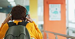Music, kid and school hallway with headphones, back and audio ready for after hours tutoring. Youth, class and student with backpack and web song in study, education and academic learning campus