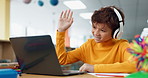 Video call, library and boy on laptop for online class, remote education or elearning with smile. Virtual school, wave or happy child student listening on headphones technology on teaching platform