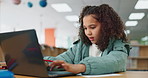 Girl, kid and typing on laptop at library for research on school project and online education. Elearning, internet and afterschool session for help, learn and study for brain development and growth