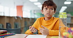 Boy, homework and counting for math at library in school with notebook for writing notes. Kid, education and thinking with stationery for project with numbers for child growth and brain development