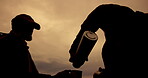Sunset, hiking and silhouette of men with coffee for outdoor adventure, break and warm beverage. Clouds, trekking and friends with drink in travel flask for mountain, journey or caffeine in Argentina