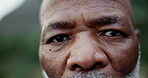 Black man, face and closeup of eyes outdoor for fitness, retirement and hiking with commitment in morning. Mature person, portrait and serious in nature with determination for workout and exercise