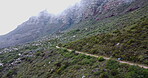 Fitness, hiking and running with people in mountains together for morning cardio or exercise. Challenge, marathon and trail with runner friends outdoor in nature for sports, training or workout