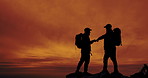 Fist bump, hiking and silhouette of friends outdoor in mountains at sunset for celebration of goals. Mock up space, orange sky and success with hiker people in nature for adventure or hobby together