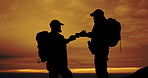 Man, silhouette and drink with backpack on mountain for hiking break, rest or toast together. Male person or friends sharing beverage with cheers for trekking adventure or evening journey in nature