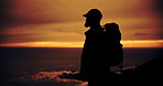 Mountain, sunrise and shadow of man with hiking, travel and camp backpack with view and cliff. Silhouette, eco park and outdoor in the morning in nature with fitness, exercise and wellness with fog