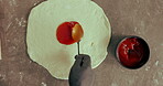 Hands, chef and sauce on pizza dough for baking, cooking or catering in kitchen above. Bread, person or apply tomato on flour for meal prep, food or production process with spoon for Italian cuisine 