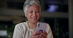 Night, mature woman and happy with smartphone in office on break with social media post. Female person, employee and smile for funny memes, videos and comments for online networking and communication