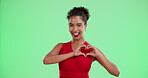 Face, woman and hand with heart on green screen for valentines day, flirt gesture and love connection. Happy, female person and care emoji for date inspiration with romance on studio background