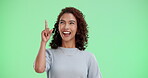 Happy, woman and pointing up on green screen of announcement direction, promotion news or advertising sale. Excited, female person and finger gesture of coming soon, brand launch or studio background