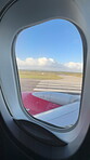 Outdoor, road and wing of airplane by window, international and ready for takeoff in London. Transport, abroad and global flight in runway for arrival, destination and terminal location for aircraft