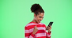 Phone, happy and woman with celebration by green screen for matchmaking, success and notification. Person, fist and tech with smile in achievement for dating app, response and online profile info