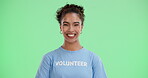 Volunteer, woman and smile in green screen with heart gesture for love, support and care. Portrait, studio and happy or exited with confident on community service or charity for change, trust and NGO