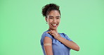 Happy woman, nurse and vaccination with plaster on green screen for cure or immunity on a studio background. Portrait of young female person or medical employee with smile for vaccine on mockup space